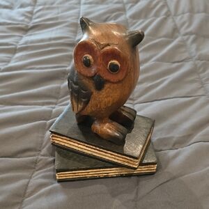 Wooden Owl Figurine on Books